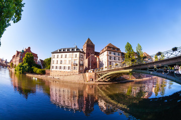 Fototapeta premium Green bridge over the Ill river in Strasbourg
