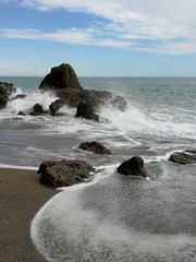 waves crashing on rocks