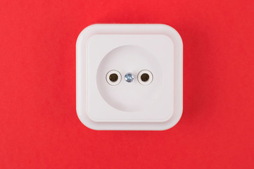 white socket on a red background