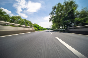 Fototapeta premium empty road with city skyline