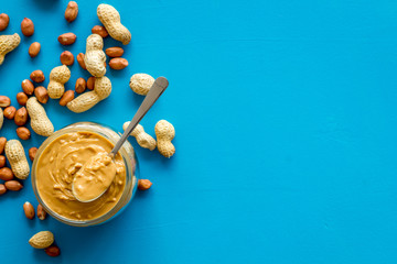 peanut butter for cooking breakfast at home on blue background top view mock up