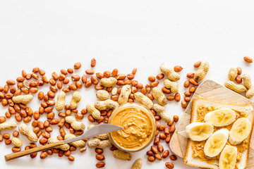 peanut butter and banana for cooking breakfast with sandwiches at home on white background top view mock-up