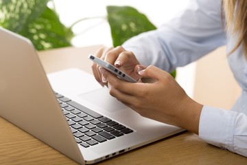 Closeup of a Businesswoman Using Smartphone