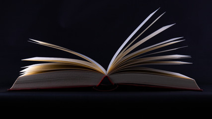 open book on black background