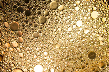 the glare on the texture of the bubbles solid background on the water