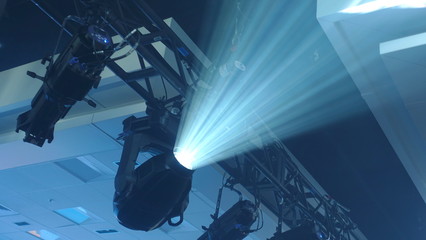 Blue light beam created by fog machine