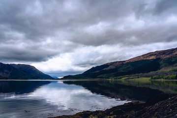 Scotland Highland valley mountain water foreground low angle Glen Etive Glen Coe