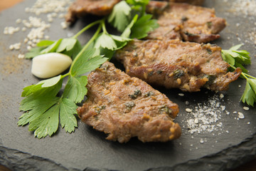 Korean grilled meat, bulgogi, slices, barbecue meat closeup