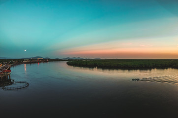 Amazing sunset over water and a boat 