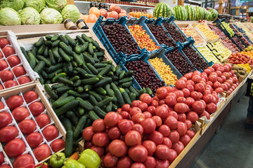 Vegetable farmer market counter: colorful various fresh organic healthy vegetables at grocery store. Healthy natural food concept