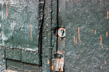 old wooden door with lock craquelure cracked paint