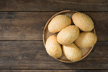 Buns with sesame seeds. Pastry. Rustic style