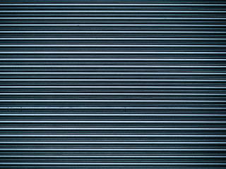 Horizontal folding metal door texture.Blue color,