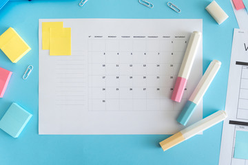 Stationery and planner on blue pastel background