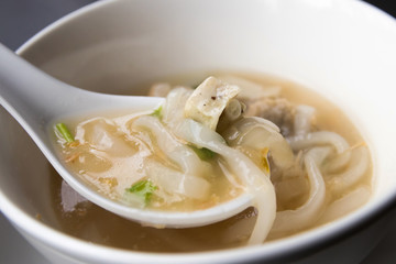 Pork spare ribs rice noodles soup; Vietnamese traditional food style.