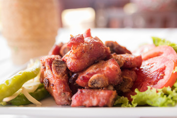 Deep fried pickled pork spare ribs served with sticky rice in Kratip (northern and northeastern Thais as containers for sticky rice)