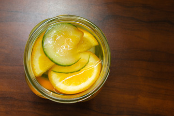Healthy lifestyle. Detox drink with cucumber, lemon, orange, ginger in a glass