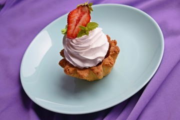 Delicious cakes baskets of short pastry with jam and cream.