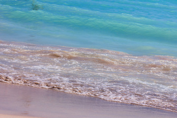 Blue wave on the sea, sandy coast