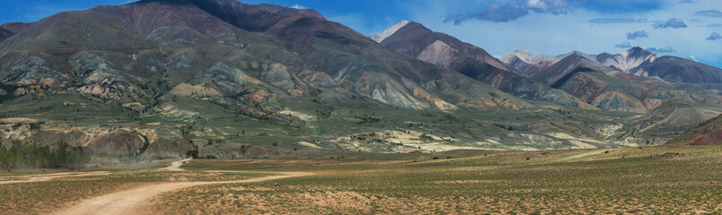 Fototapeta na wymiar Panoramic picture of colored mountains near Mongolian Altai mountains, Russia.