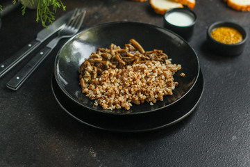 buckwheat porridge with mushrooms. food background. top view. copy space