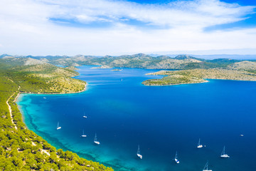 Aerial view of the blue bay and small islands in nature park Telascica, Croatia, Dugi otok, yachts anchored on shore