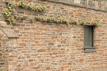 Isolated wooden window in a brick wall background (Germany, Europe)