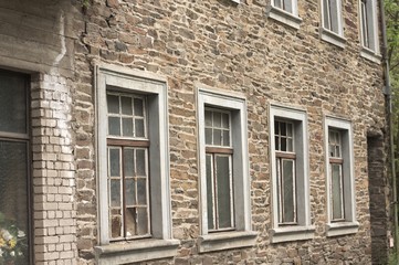 A series of windows in a brick wall background (Germany, Europe)