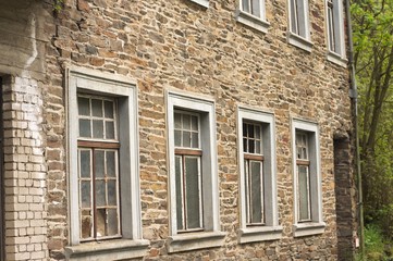 A series of windows in a brick wall background (Germany, Europe)