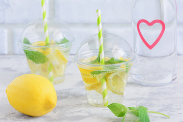 Cool Water with Lemon Mint Leaf Detox Beverage. Weight Loss Nutrition. Homemade Organic Lemonade in...