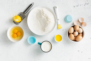 Baking ingredients cooking homemade muffins or lemon cookies. Bakery background top view