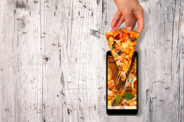 Order and food delivery from your smartphone. Smartphone on wooden background