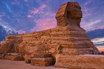 Sphinx against the backdrop of the great Egyptian pyramids. Africa, Giza Plateau.	