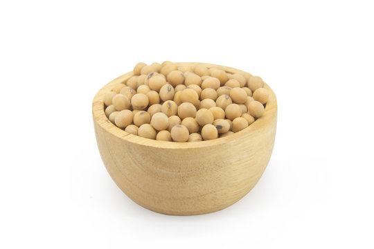 Soy beans in bowl wood isolated on white background with clupping path