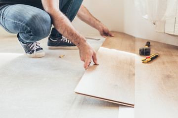 Longitudinal lock joint - The sequence of technological methods for laying and installation of floating flooring - laminate - professional work