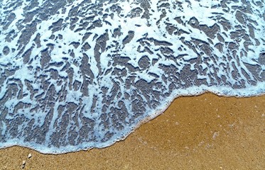 Wave of the Sea on a Beach