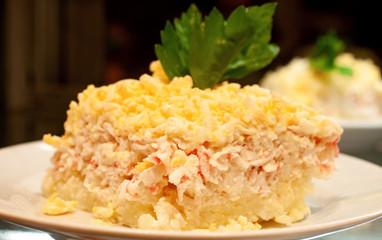 Salad for the feast of Mimosa on a plate, portioned dish