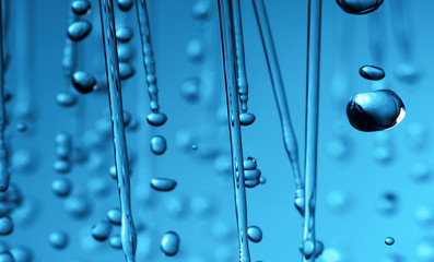 Naklejka na ściany i meble rain drops of water close-up macro on a blue background