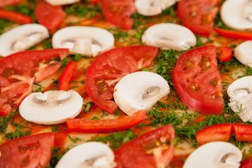 Raw pizza fragment with tomatoes and mushrooms, macro