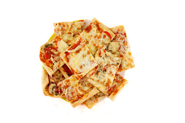 Homemade sliced pizza on white background, close-up shot, top view