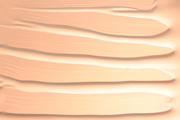 Liquid foundation texture. Make up for women. Top view.