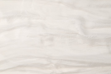 Soft smooth white silk fabric background. Fabric texture.