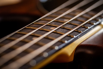 Fototapeta premium OCTOBER 2, 2017 - MALAGA, SPAIN. Close-up of strings and frets on an electric bass guitar