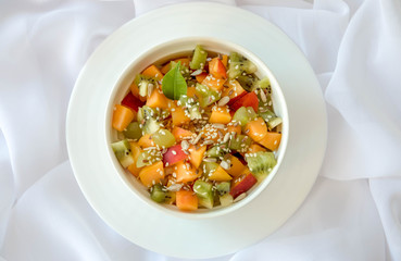 Appetizing fruit salad, on a white background