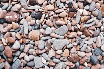 Multicolored colorful sea pebbles, natural background, texture. Close-up texture of colorful sea pebbles. Small Rock. Sea background