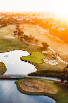 Aerial view of golf course and lake
