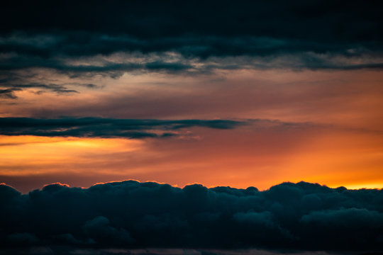 Sunset between dark cloud lines