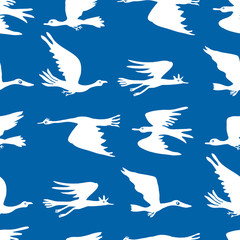Seamless pattern of silhouettes of migratory birds in flight