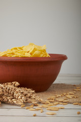 Rolled oats, healthy breakfast cereal oat flakes in bowl on wooden table