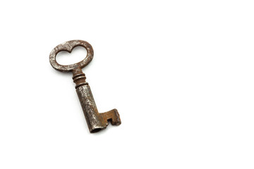 Small old rusty antique key on white background
